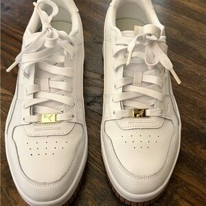 Puma White Sneakers with Gold Accents